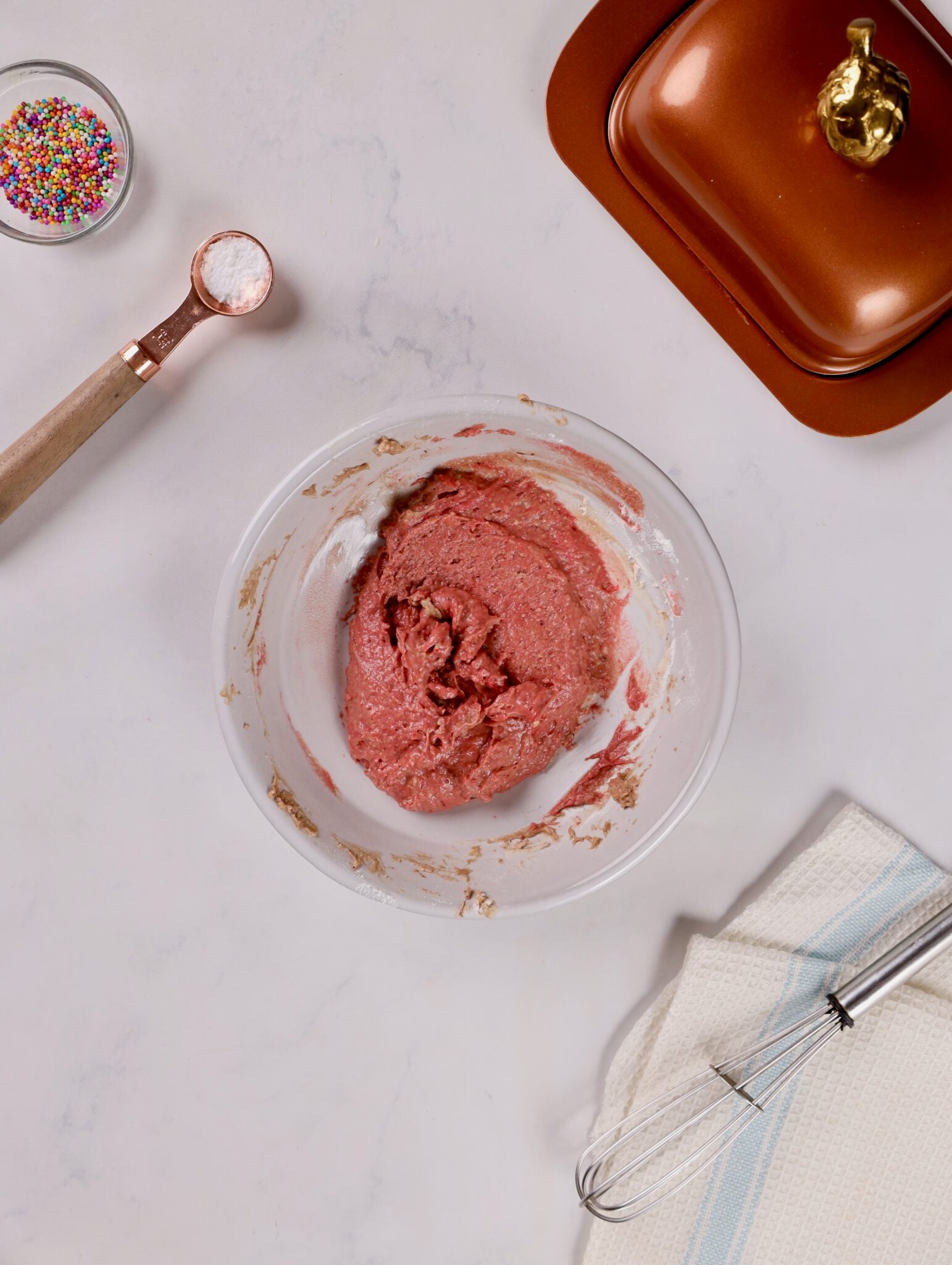 Mixing bowl filled with rich red velvet cake batter