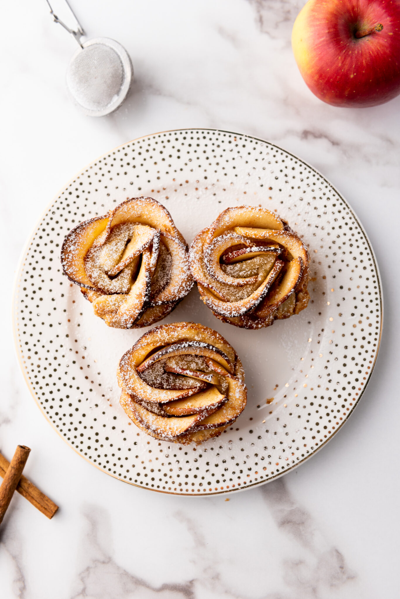 A tantalizing array of baked apple roses, their crispy edges and soft centers making a visual symphony, ready to be savored by dessert enthusiasts