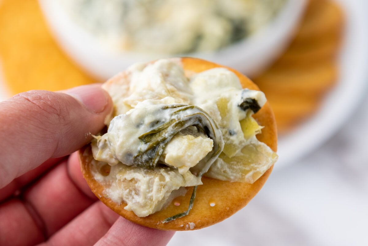 spinach artichoke dip on a cracker