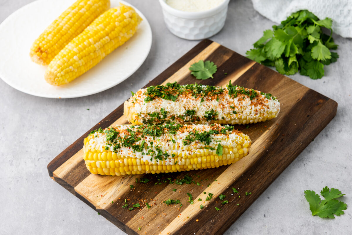 cooked elote recipe on a cutting board