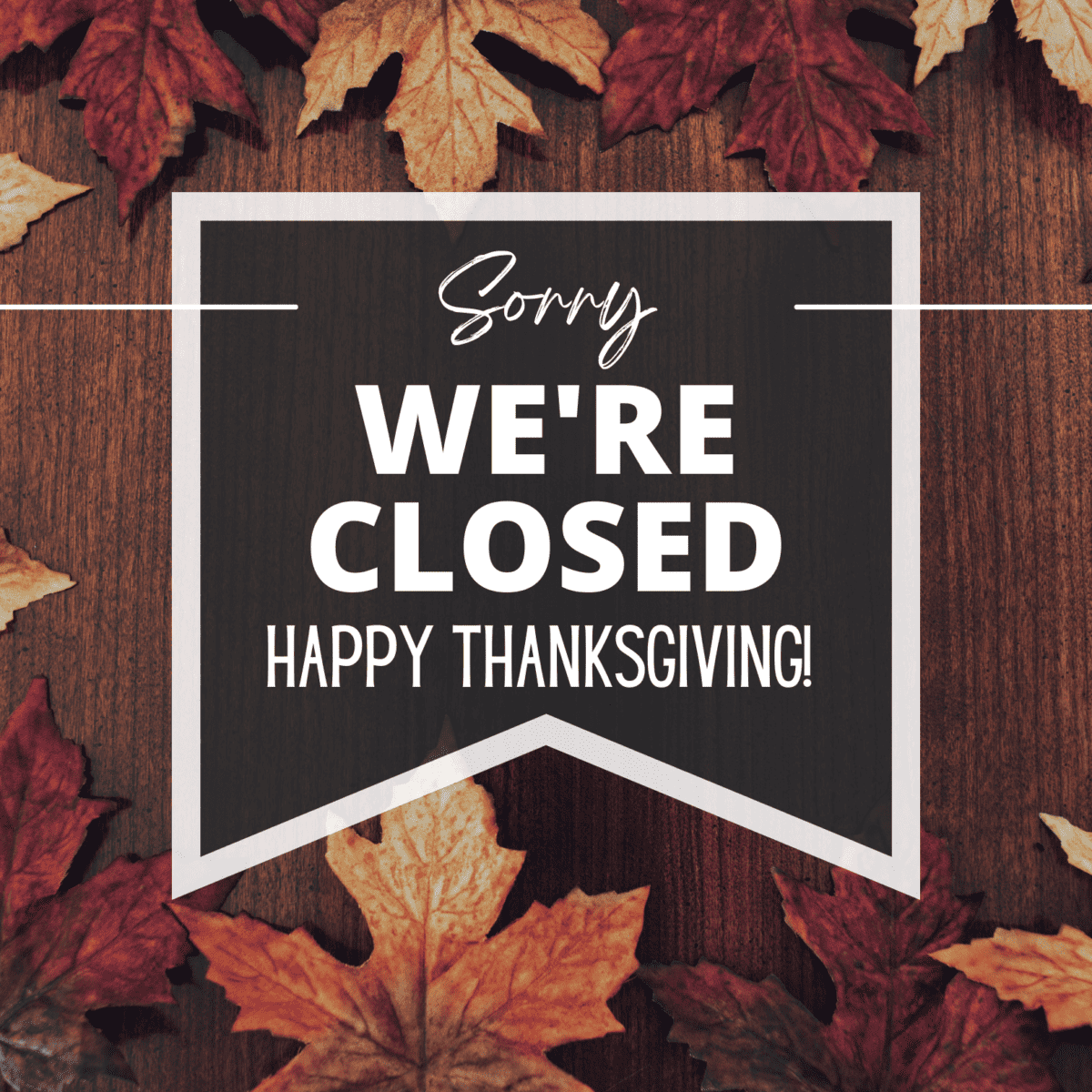 Free printable closed for Thanksgiving holiday sign surrounded by autumn leaves.