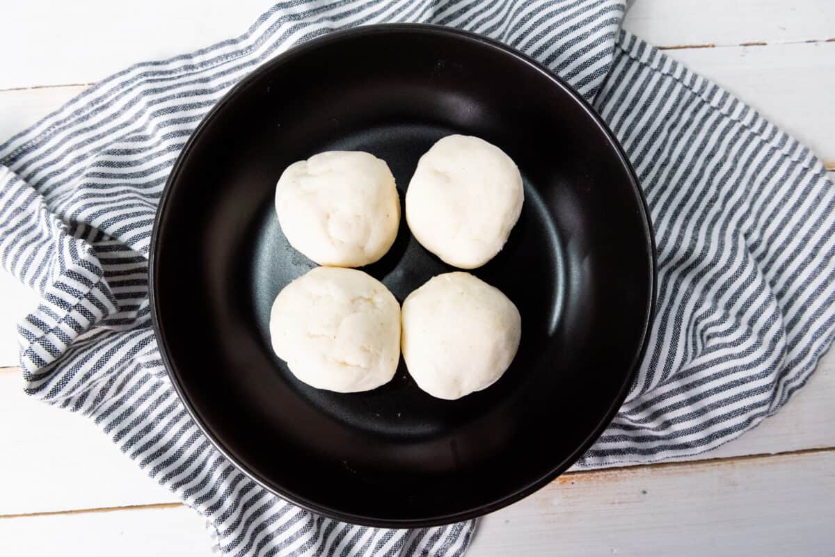 Shaping the arepa dough into balls