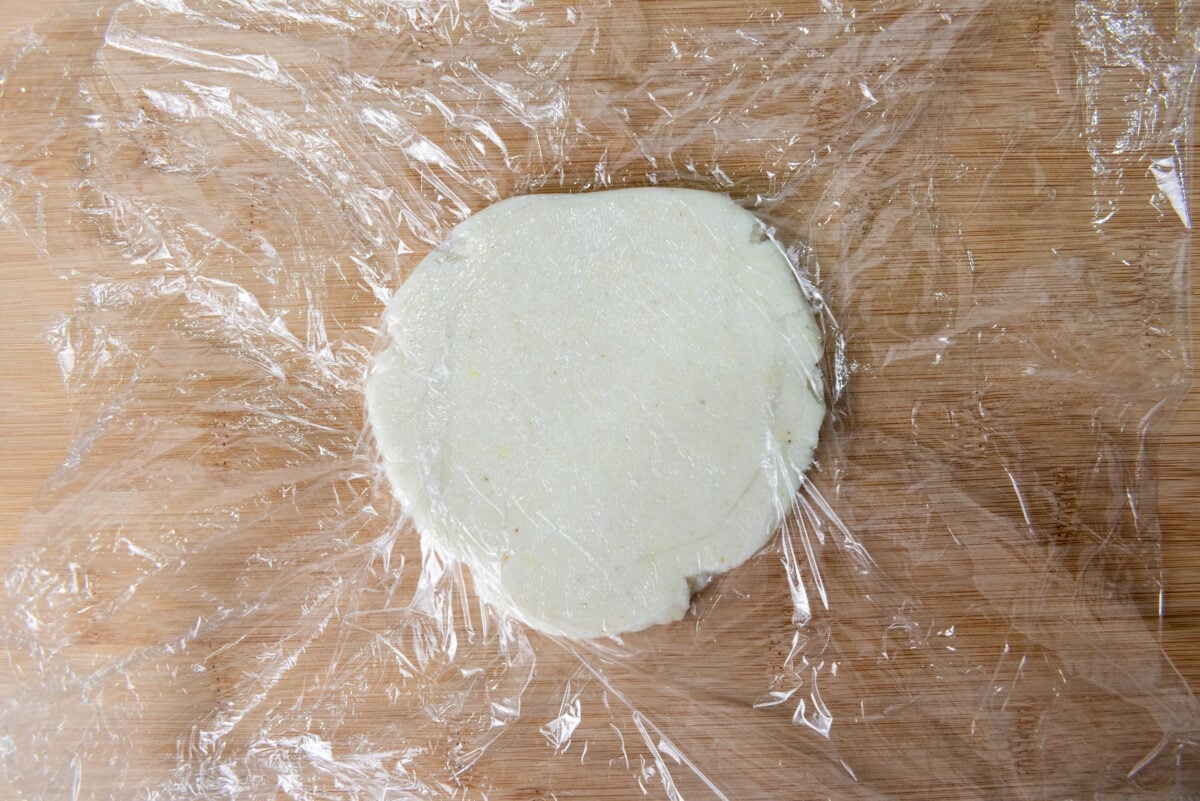 Flattened arepa ready for frying