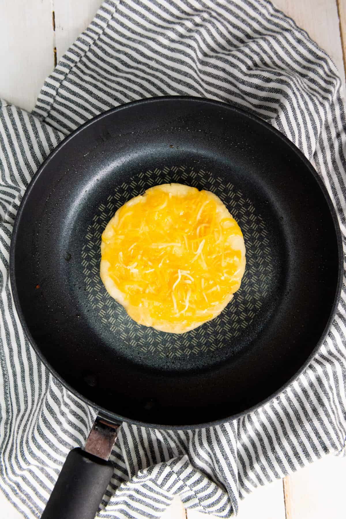 Melting cheese atop the arepa