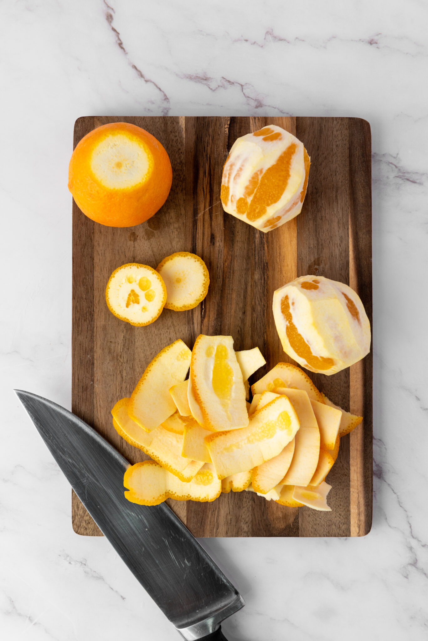 oranges peeled on cutting board