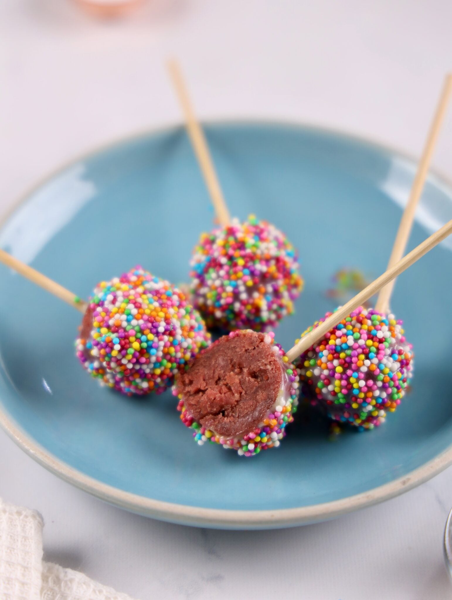 red velvet cake pops on a plate