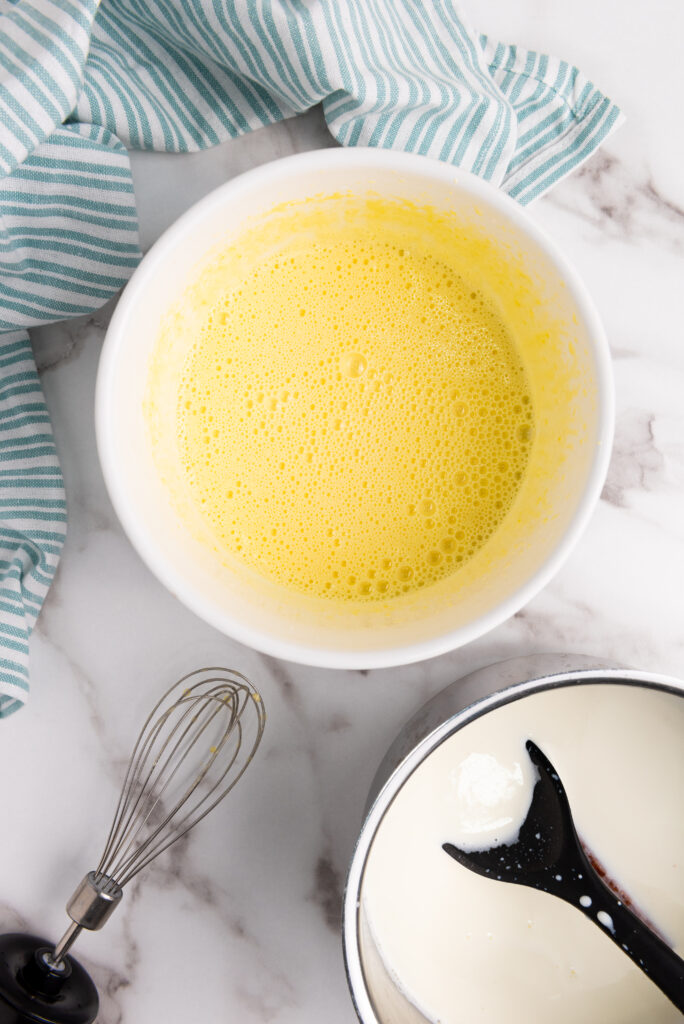adding eggs to milk mixture