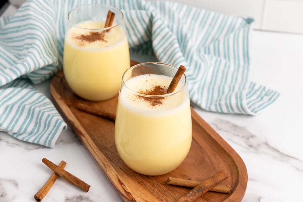 no alcohol eggnog recipe in two glasses with cinnamon