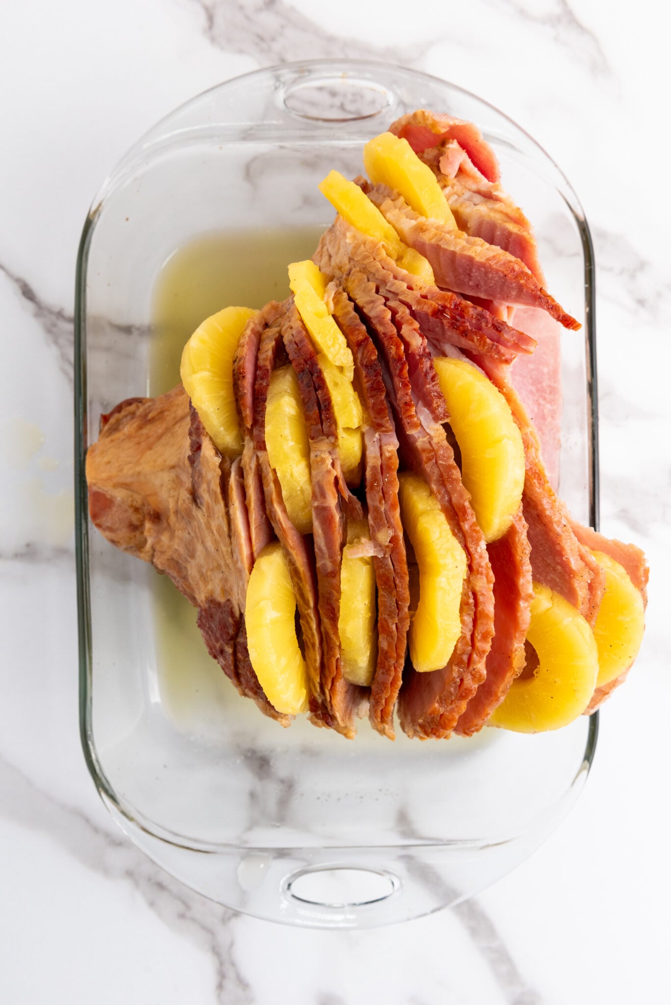 adding pineapple juice to ham