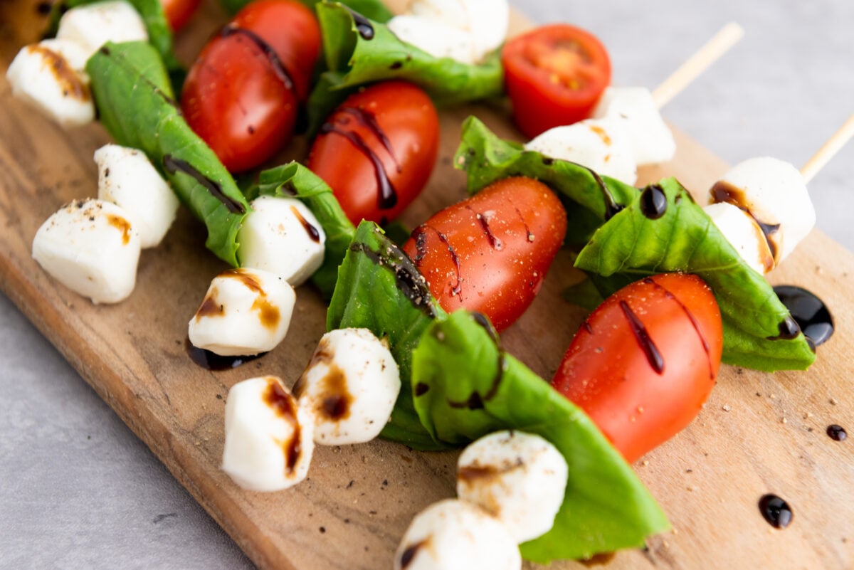 easy Caprese Skewers on a cutting board