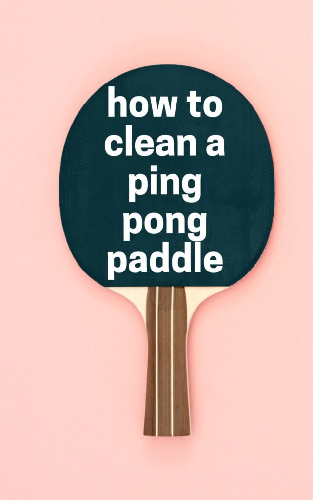 A ping pong paddle against a pink background with text "how to clean ping pong paddle" written on the paddle.