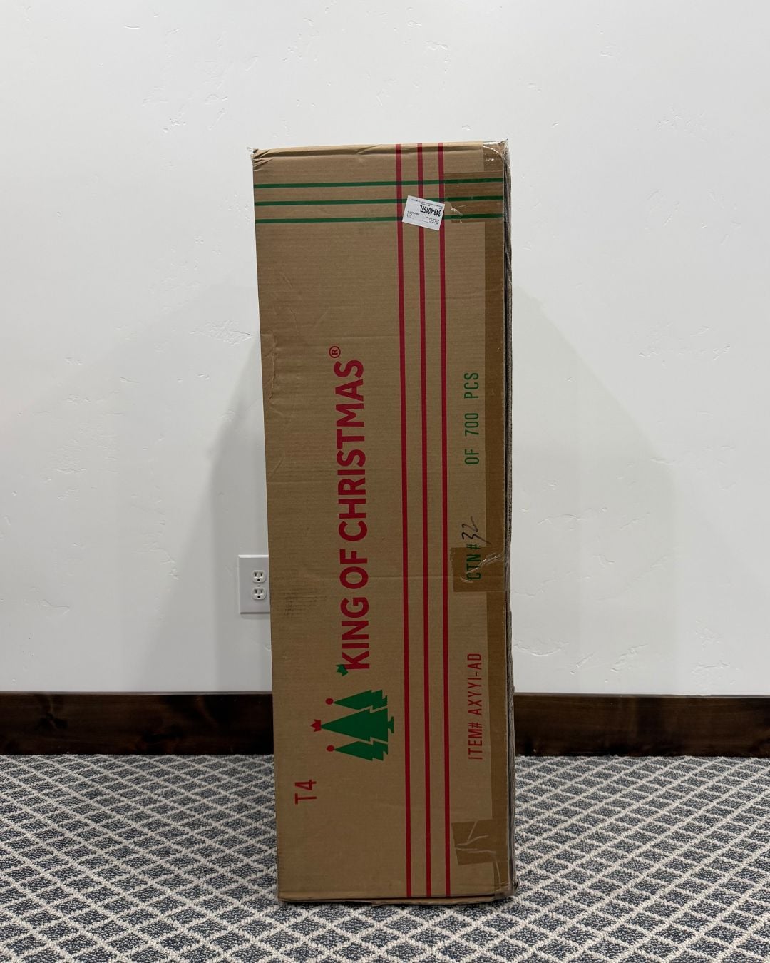 King of Christmas artificial Christmas tree arriving in its original shipping box before assembly.